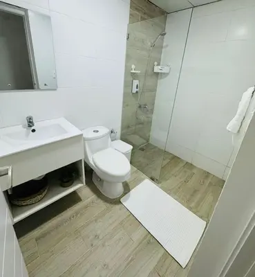 a bathroom with a toilet and a sink and a shower at Your ideal getaway awaits! in Punta Cana