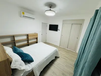 a bedroom with a bed and a television in it at Your ideal getaway awaits! in Punta Cana
