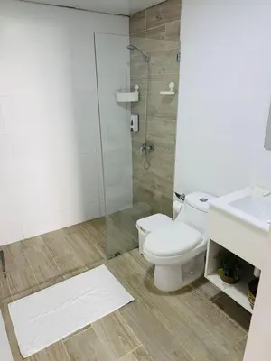 a bathroom with a toilet and a glass shower at Your ideal getaway awaits! in Punta Cana