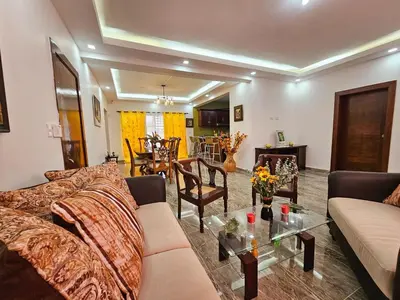 a living room with a couch and a table at Magnificent accommodation in Puerto Plata