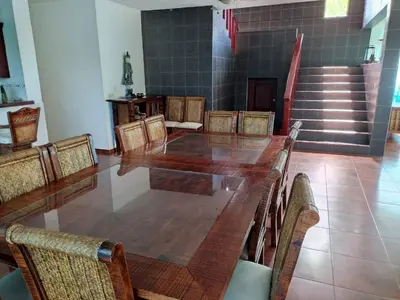 a conference room with a long wooden table and chairs at Natural Pool Villa perfect for families in Río San Juan