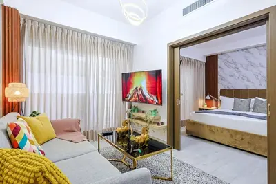 a living room with a bed and a couch at Comfy 1BR Apt, King Bed, Pool in Santo Domingo
