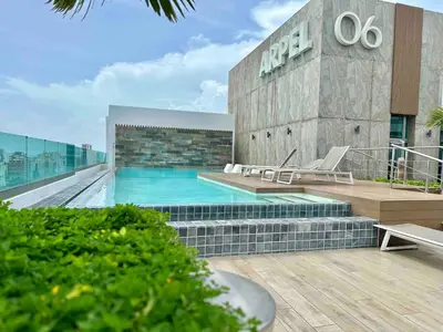a swimming pool on the roof of a building at Cozy City-Center 1BD Condo, Pool in Santo Domingo