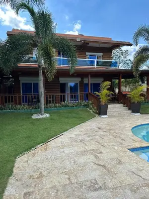 a house with a palm tree in front of it at Luxury Villa with Pool, jacuzzi,Basketball and more