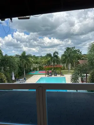 a view of a swimming pool from a balcony at Luxury Villa with Pool, jacuzzi,Basketball and more