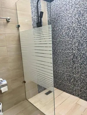a shower with a glass door in a bathroom at Casa colinas del viento in Jacagua