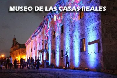a large building with blue and white lights on it at Apartamento Las Carreras in Santo Domingo
