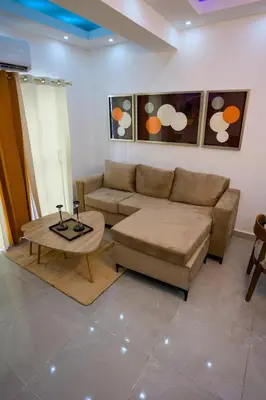 a living room with a couch and a coffee table at Amazing 2BR apartment near the airport in Los Frailes