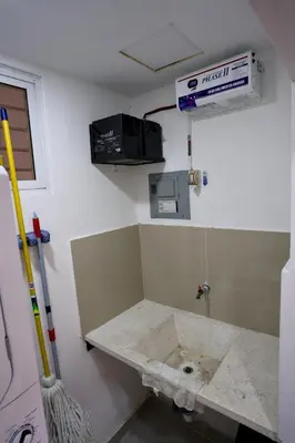 a bathroom with a sink in a room at Amazing 2BR apartment near the airport in Los Frailes