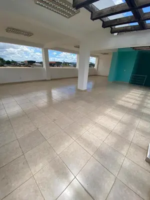 an empty room with a tile floor and large windows at Beautiful apartment near STGO airport in Santiago de los Caballeros