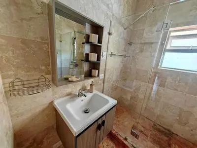a bathroom with a sink and a shower at Apartman Tamarindo in La Laguna