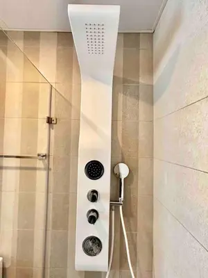 a shower in a bathroom with a shower head at Comfy 1BR Apt, Full AC, Pool. in Santo Domingo