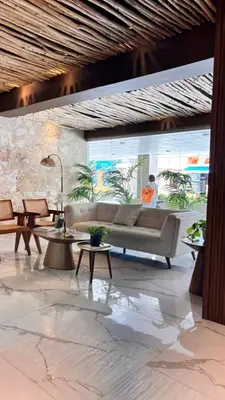 a living room with a couch and tables at Tropical Seaside Bliss DGM Resort at BocaChica in Boca Chica