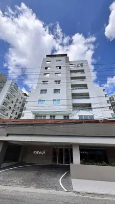 a large white building with a store in front of it at Tropical Seaside Bliss DGM Resort at BocaChica in Boca Chica