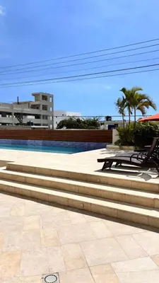 a group of steps leading to a swimming pool at Tropical Seaside Bliss DGM Resort at BocaChica in Boca Chica