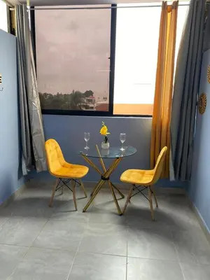 a dining room with a table and two chairs at Beach Days & City Nights! Centrally Near Everything in Santo Domingo