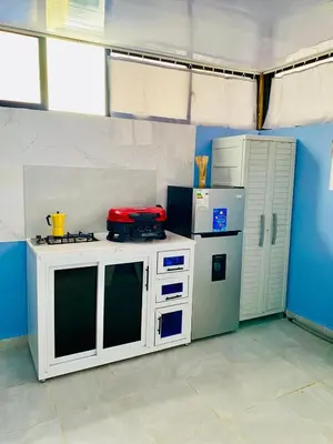 a kitchen with a stove and a refrigerator at Beach Days & City Nights! Centrally Near Everything in Santo Domingo