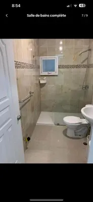a bathroom with a toilet and a sink at Jolie condo in Boca Chica