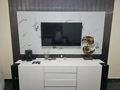 a tv on top of a white dresser in a room at Dreamvillage in Boca Chica