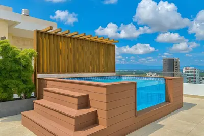 a swimming pool on the roof of a building at Upscale City Center Condo in Santo Domingo