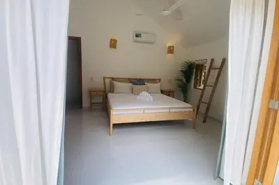a bedroom with a bed in a room with aermottermott at Bonita Beach Villa in Las Terrenas
