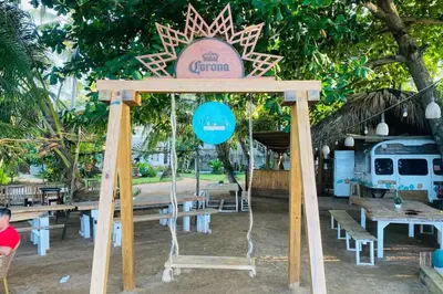 a wooden arch with a sign that reads gonia at Bonita Beach Villa in Las Terrenas