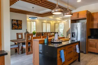 a kitchen and dining room with a dining table at Villa Monaco RD in Concepción de La Vega
