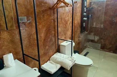 a bathroom with a shower and a toilet and a sink at Villa Modena in Las Terrenas