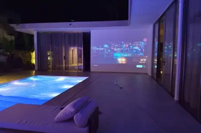 a room with a swimming pool in a building at Villa Modena in Las Terrenas