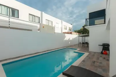 a swimming pool in the backyard of a house at Luxury Villa with Private Pool in Punta Cana in Punta Cana