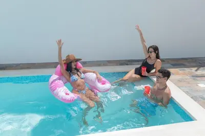 a group of people sitting in a swimming pool at Luxury Villa with Private Pool in Punta Cana in Punta Cana