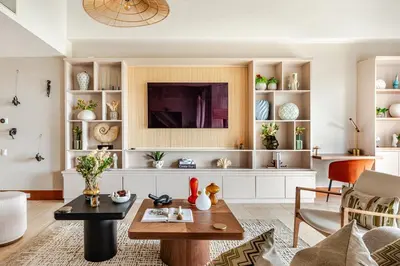 a living room with a table and a tv at Casa Cielo 3 BR Penthouse with Views in La Romana