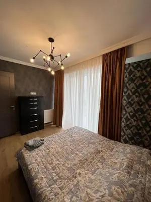 a bedroom with a bed and a dresser and a window at Remanso de Paz in Pedernales
