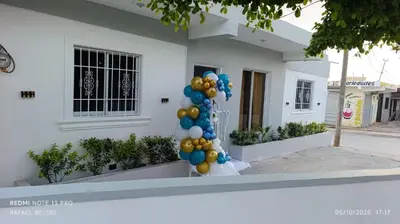 a bunch of balloons in front of a house at Remanso de Paz in Pedernales