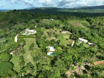 an aerial view of a house in the forest at Modern villa with private pool 1 km from the beach samana in El Limón