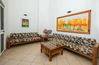 a living room with two couches and a table at Luxury Penthouse in front of the Sea in Las Terrenas in Las Terrenas