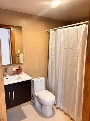a bathroom with a toilet and a sink at Your oceanfront paradise in La Puntica de Juan Dolio