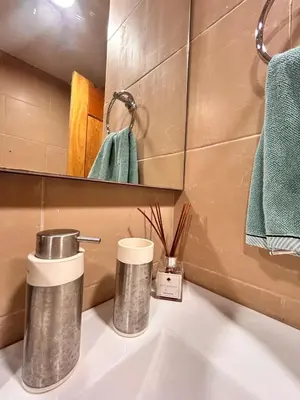 a bathroom sink with two cups on a counter at Your oceanfront paradise in La Puntica de Juan Dolio