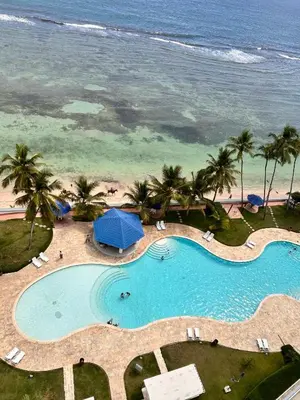 an overhead view of a swimming pool next to the beach at Your oceanfront paradise in La Puntica de Juan Dolio