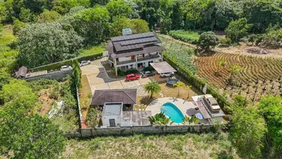 an aerial view of a house with a pool at La Vega Villa with Private Pool and BBQ in Concepción de La Vega