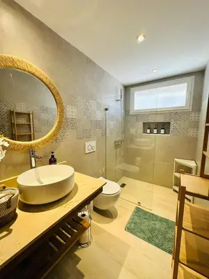 a bathroom with a sink and a toilet and a shower at IBE 402 Penthouse with Pool Garden Breeze Dominicus in La Laguna