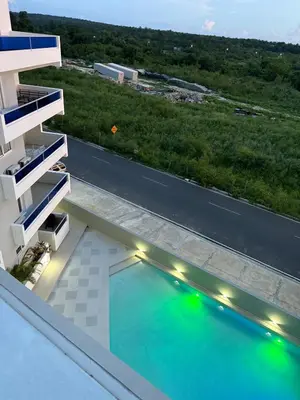 a view of a swimming pool on the roof of a building at Stay Caribbean Bayahibe Getaway in Bayahibe