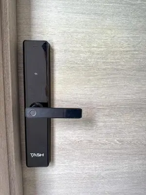 a black door handle on a wooden door at Stay Caribbean Bayahibe Getaway in Bayahibe