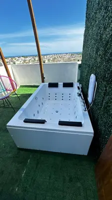 a white stove sitting next to a wall at Estancia Rincon del AMOR in Juan López
