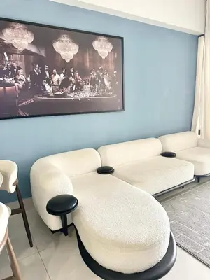 a living room with two white couches and a table at Ocean Views Escape at DGM Resort in Boca Chica