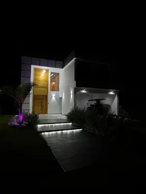 a house lit up at night with a pathway at New villa with 4 bedrooms and 5 beds in La Romana