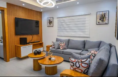 a living room with a couch and a tv at New villa with 4 bedrooms and 5 beds in La Romana
