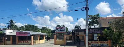 a sign for a hotel and motel on a street at hotel las yayas la vega in Concepción de La Vega