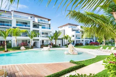 a swimming pool in front of a building at Hydra 103 Poolview Luxury Apt Dominicus in La Laguna