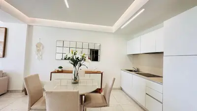 a kitchen and dining room with a table and chairs at Boca Beach Residence 304 in Boca Chica